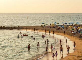 Top 10 Family-Friendly Beaches for Your Next Vacation Family fun on a bright beach.