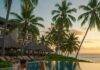 Unwind in Paradise: The Best Luxury Beach Resorts and Escapes Luxury tropical resort sunset pool