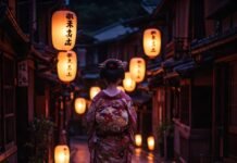 Exploring Kyoto’s Unique Culture: Top Things to Do in Japan’s Ancient Capital Geisha in kimono on lantern-lit street.
