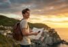 Best Budget Travel Hacks You Need to Know in 2025: Save Big! Young traveler overlooking coastal town at sunset.