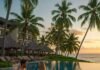Unwind in Paradise: The Best Luxury Beach Resorts and Escapes Luxury tropical resort sunset pool